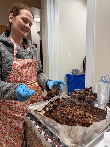 Volunteers serving food for the 40th parish anniversary